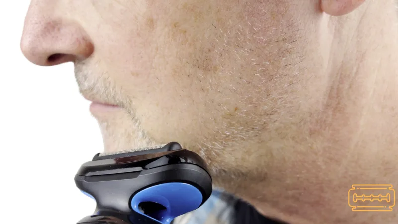 Man shaving his stubble on cheek with the Braun Series 5.